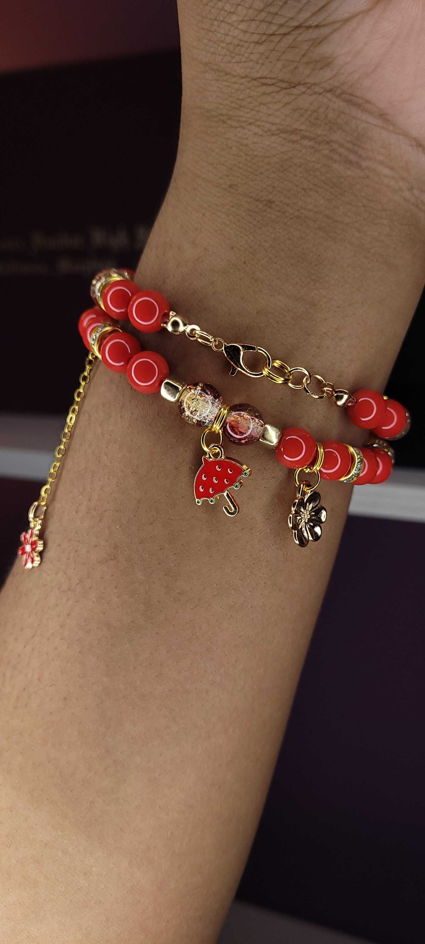 Red three charm bracelet