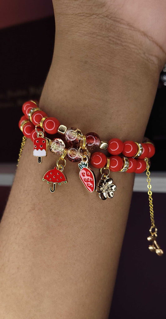 Red three charm bracelet